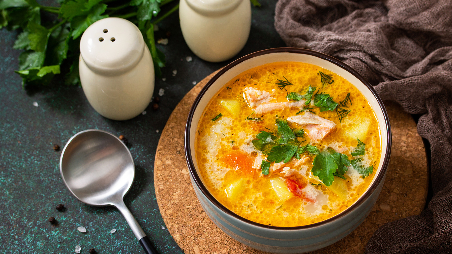 nona_0000s_0002_norwegian-soup-with-cream-salmon-rustic-wooden-table-dark-stone-background